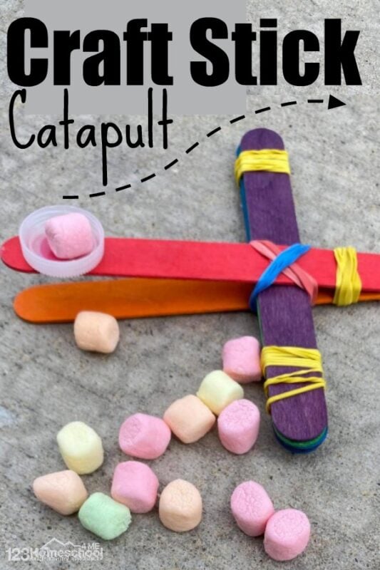 I honestly did not know that a few popsicle sticks, rubber bands and a bottle cap would shoot marshmallows as far as it did! I was so surprised. You've got to try this easy engineering and science project making a Popsicle Stick Catapult! This STEM project uses a couple simple materials you already have at home. This is such a fun 