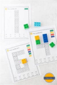 Fun, hands on preschool math activity with free printable preschool worksheet, duplo bricks, and dry erase markers to practice tracing letters